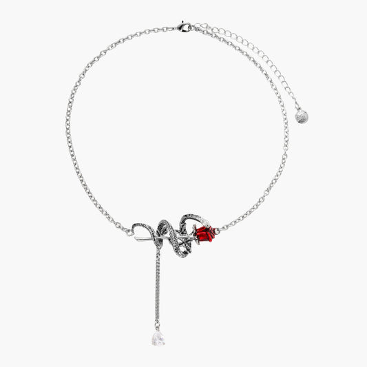 Detailed eco-brass serpent pendant necklace with red zirconia stone and crystal drop tassel on adjustable chain