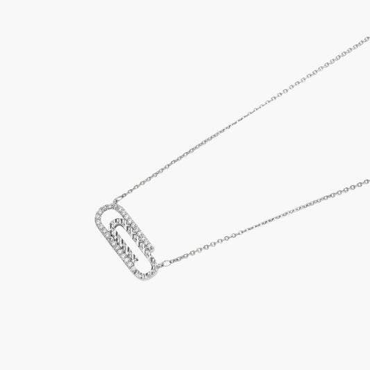 White gold plated necklace with dual-frame geometric pendant featuring crystal pavé border on pale background.