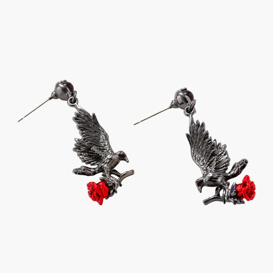 Dark gunmetal raven earrings with red rose details, featuring detailed bird wings and S925 silver posts on cream background.