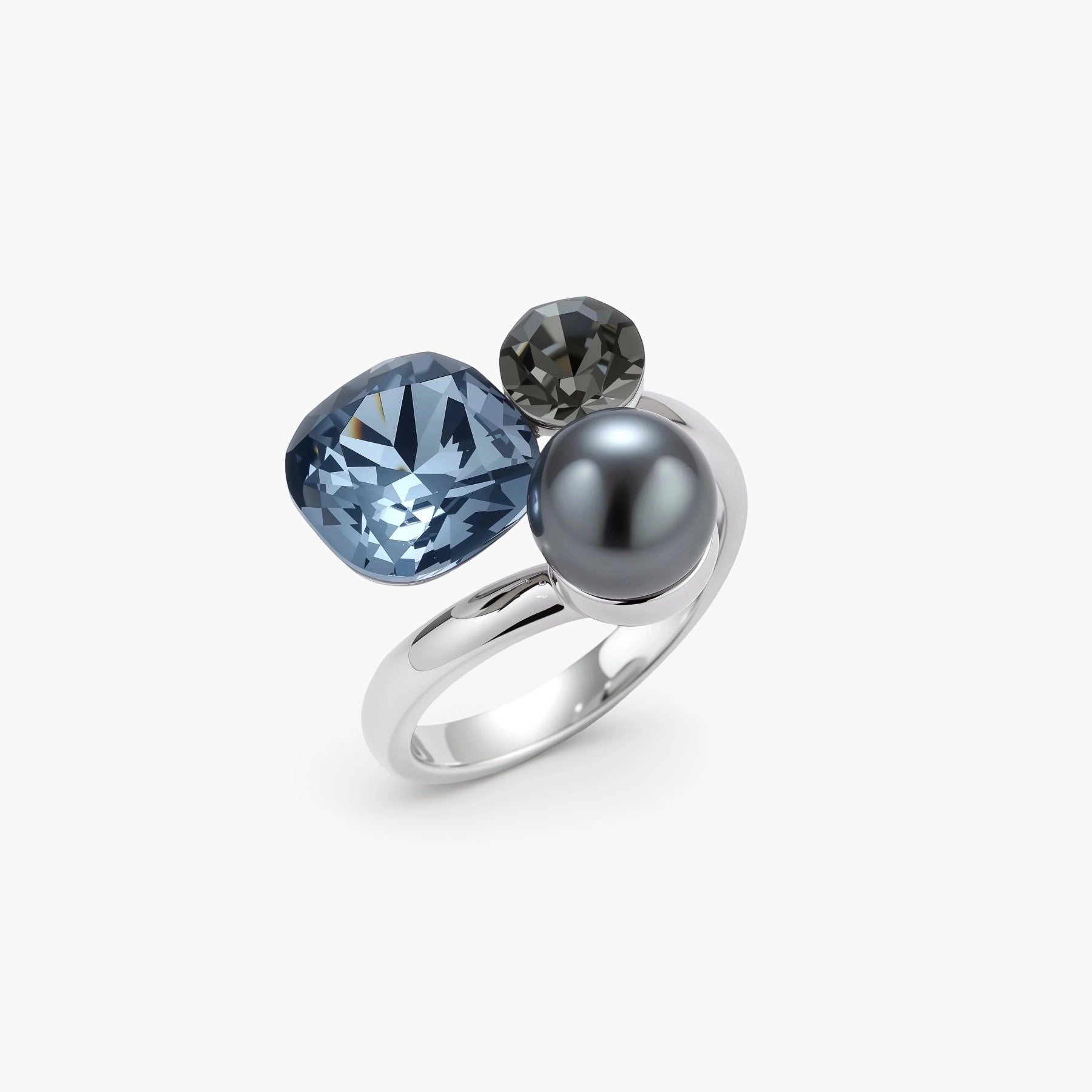 Adjustable ring with blue cushion-cut zirconia, gray pearl, and dark crystal on platinum-plated copper band against beige background.