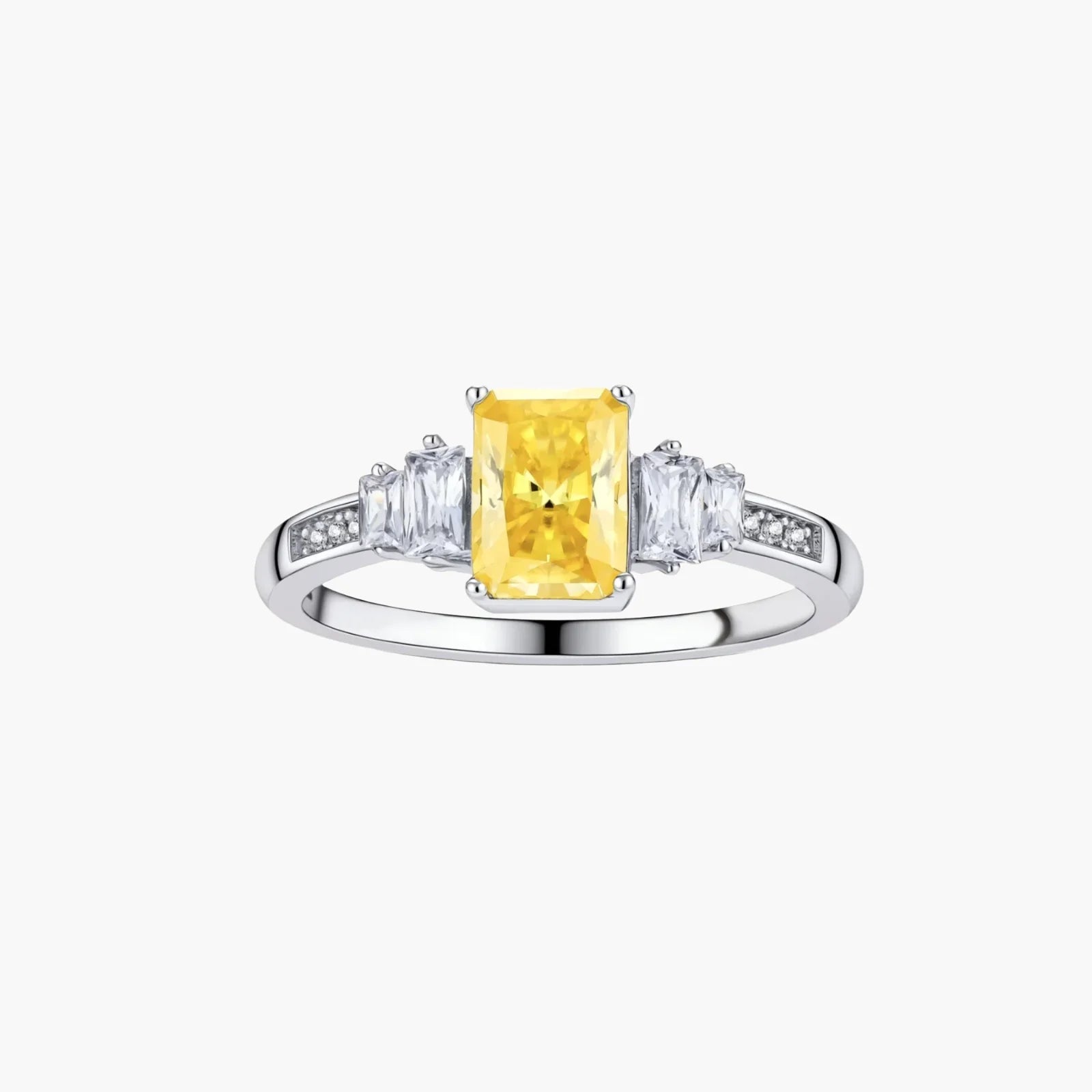 Yellow moissanite jewelry set with emerald-cut stones in sterling silver halo settings on white background.