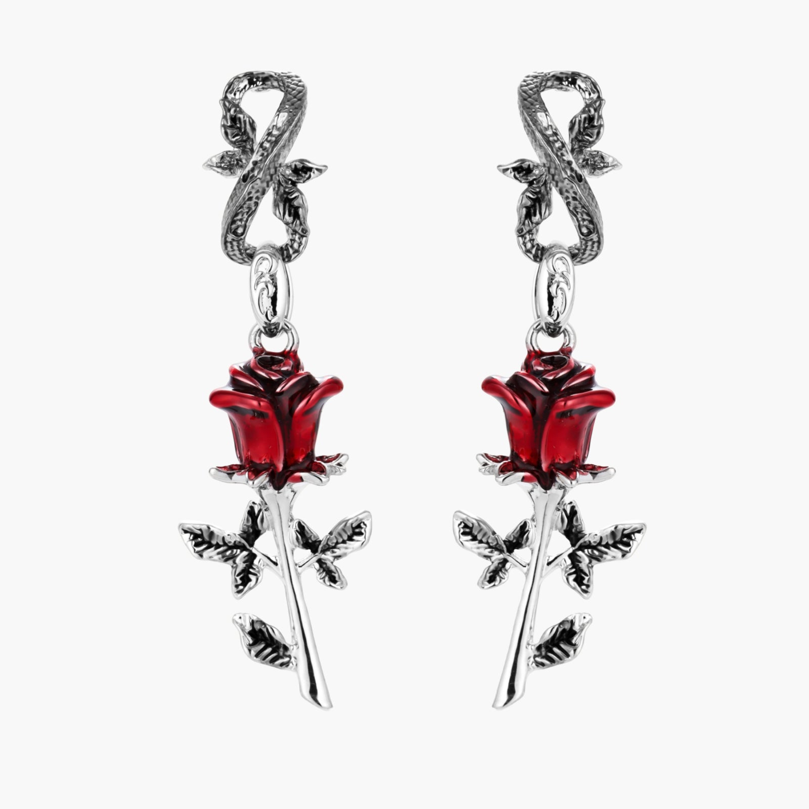 Gothic dangle earrings featuring silver serpent hooks with red enamel roses and metallic stems on white background.
