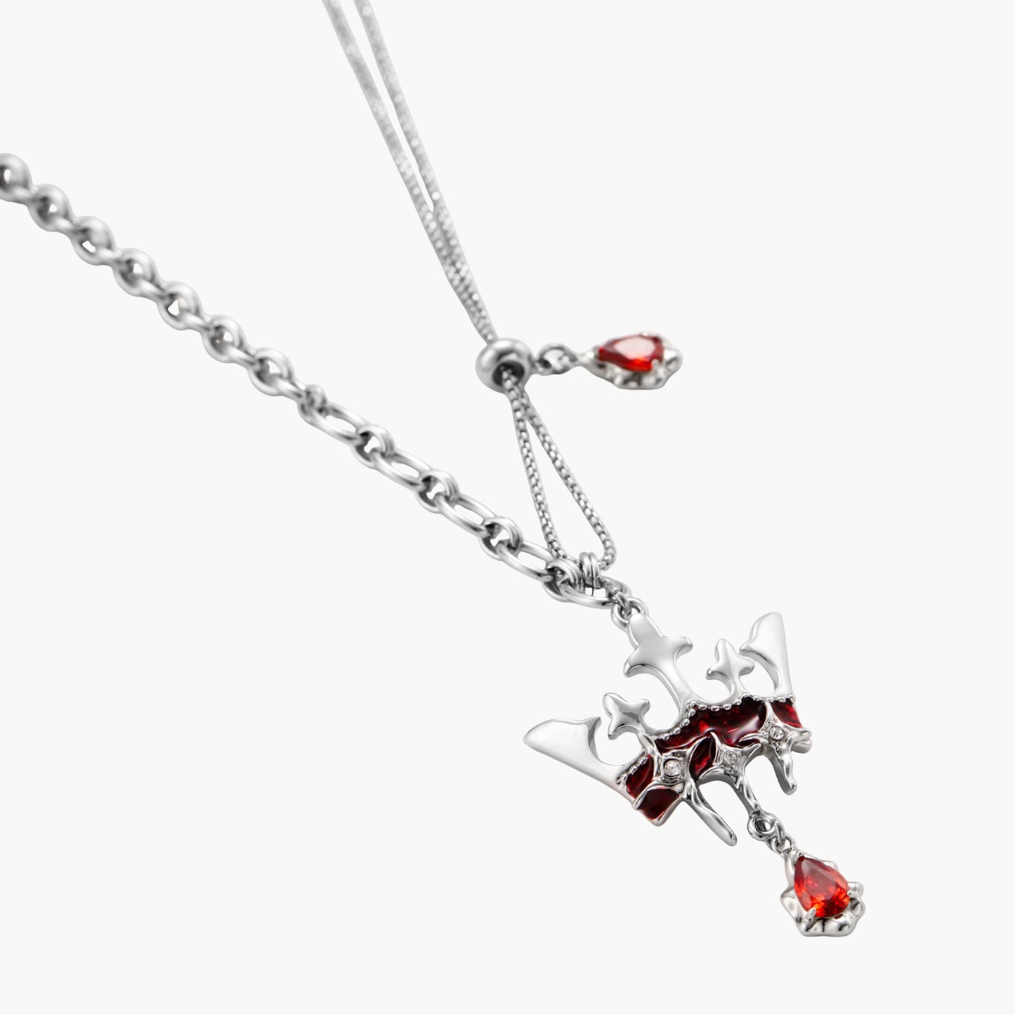 Eco-brass crown pendant necklace with red enamel details and dangling zirconia stone on chunky adjustable chain