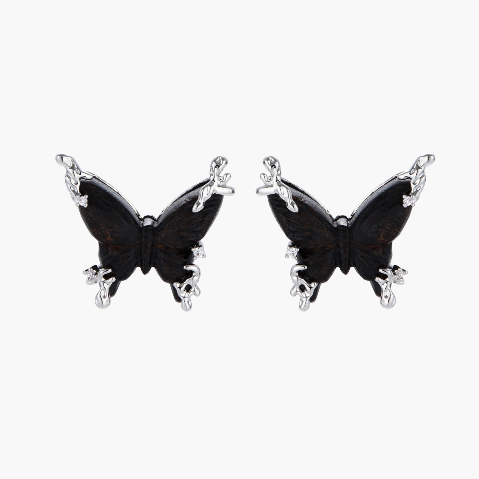 Wooden butterfly earrings with silver chain details in light and dark wood variants on white background