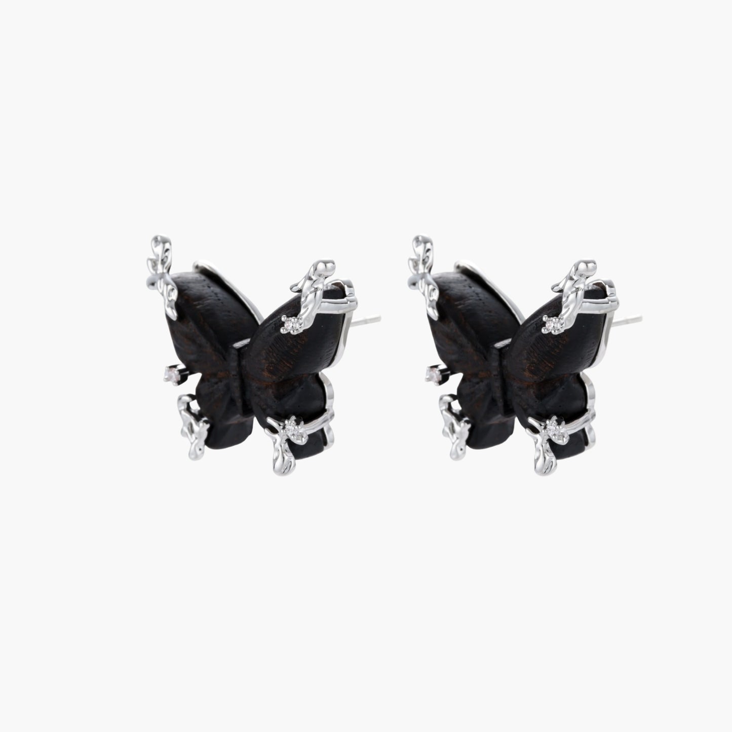 Wooden butterfly earrings with silver chain details in light and dark wood variants on white background