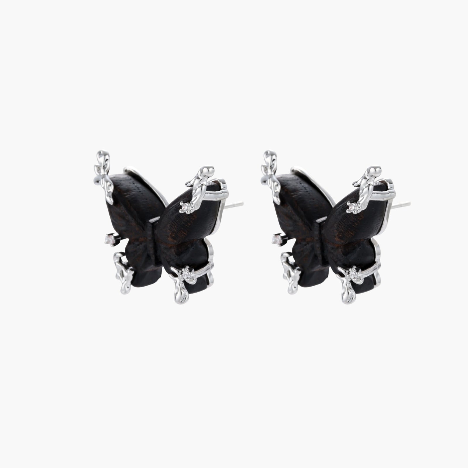 Wooden butterfly earrings with silver chain details in light and dark wood variants on white background
