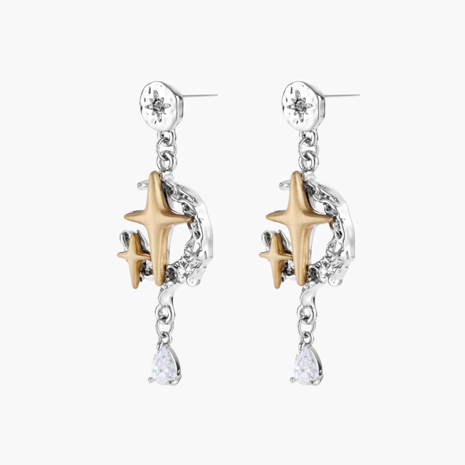 Two-tone star earrings with gold celestial motifs, silver chains, and clear crystal droplets on white background.