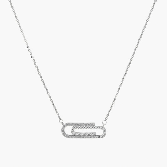 White gold plated necklace with dual-frame geometric pendant featuring crystal pavé border on pale background.
