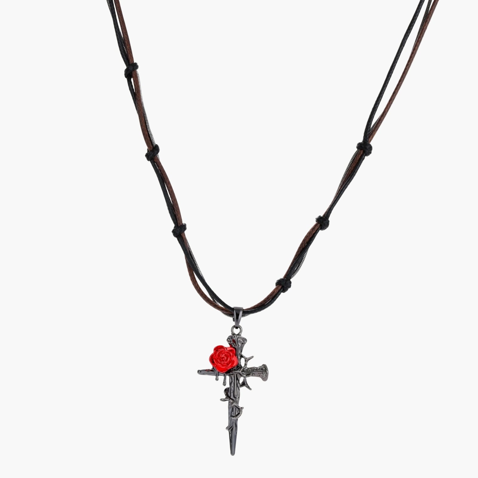 Gothic cross pendant with red enamel rose and thorn details on adjustable brown cord necklace against white background.