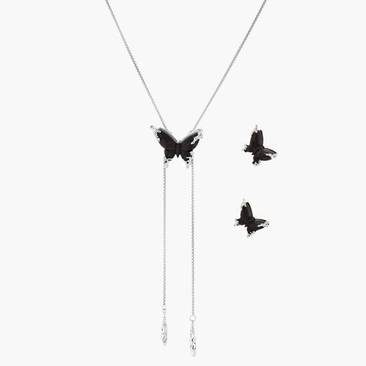 Dark wood butterfly earrings and necklace with silver chain accents on white background, showing natural grain texture.