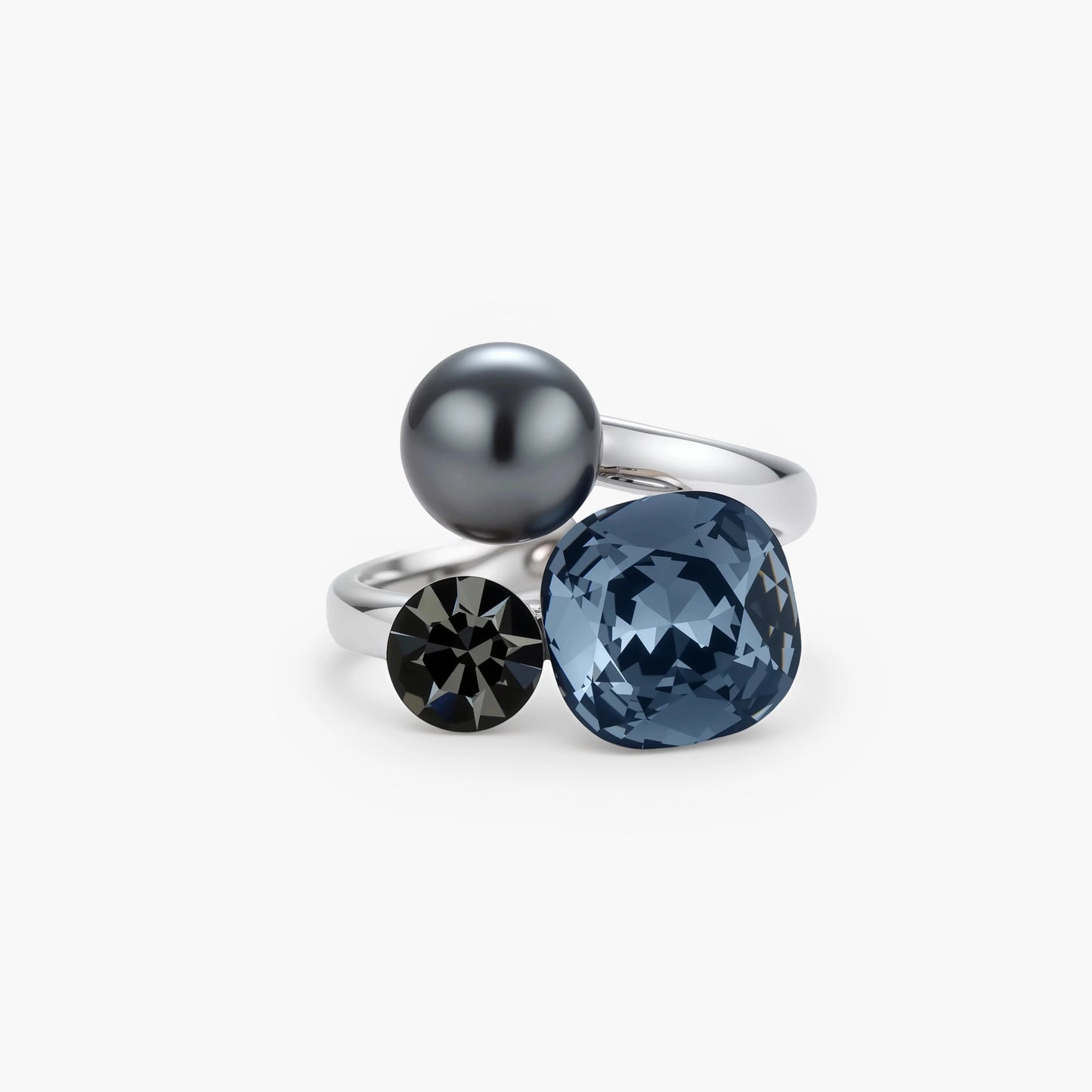 Adjustable ring with blue cushion-cut zirconia, gray pearl, and dark crystal on platinum-plated copper band against beige background.